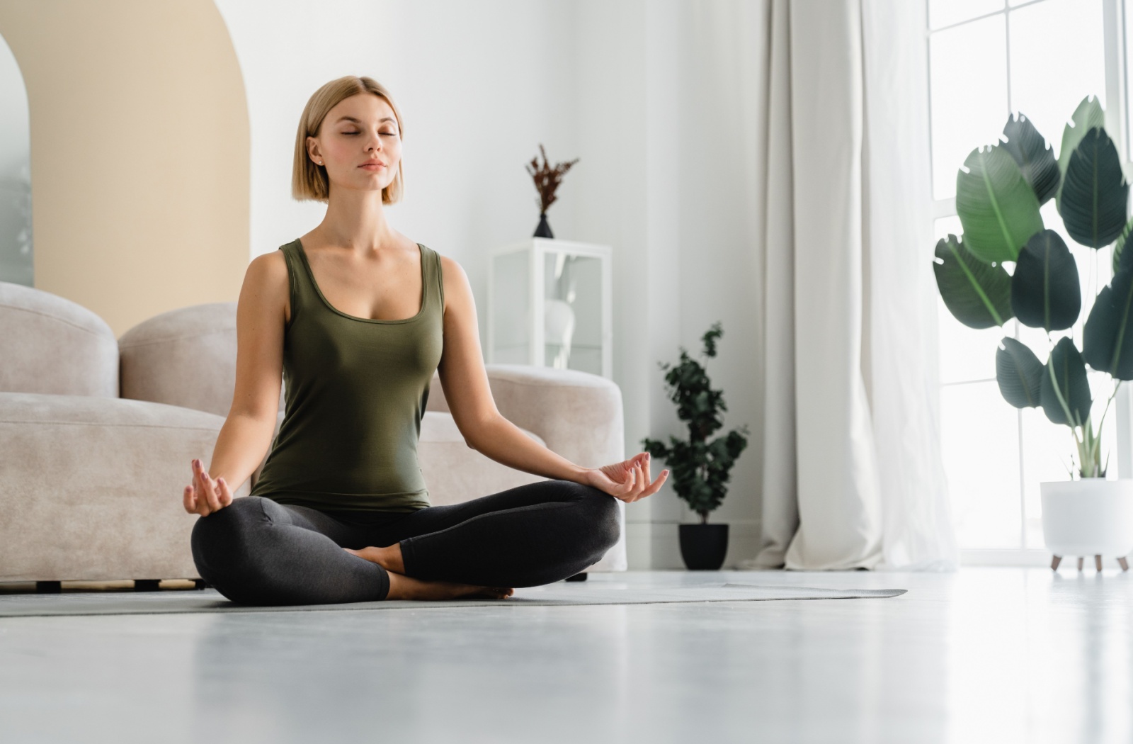 Person being mindful when doing yoga and keeping their head above their heart.