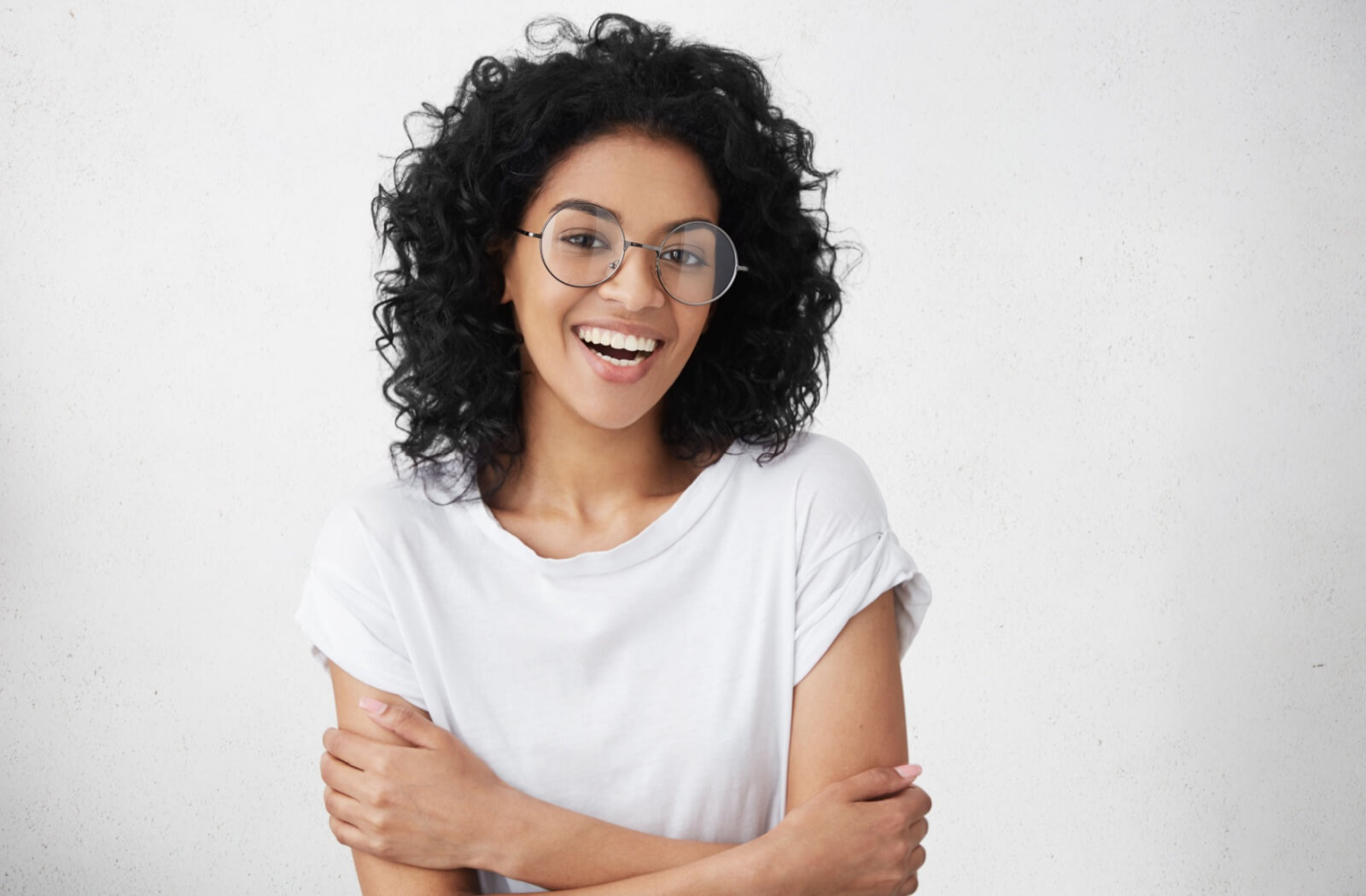 A young adult patient with a straight, bright smile after orthodontic treatment.